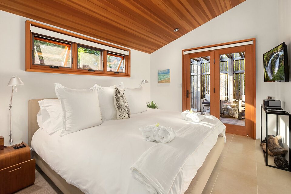 bedroom with french doors to balcony